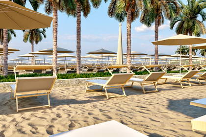 Puste leżaki i parasole w rzędach na plaży z palmami.