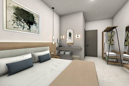 Nowoczesny pokój hotelowy z łóżkiem, otwartą garderobą i umywalką nablatową.